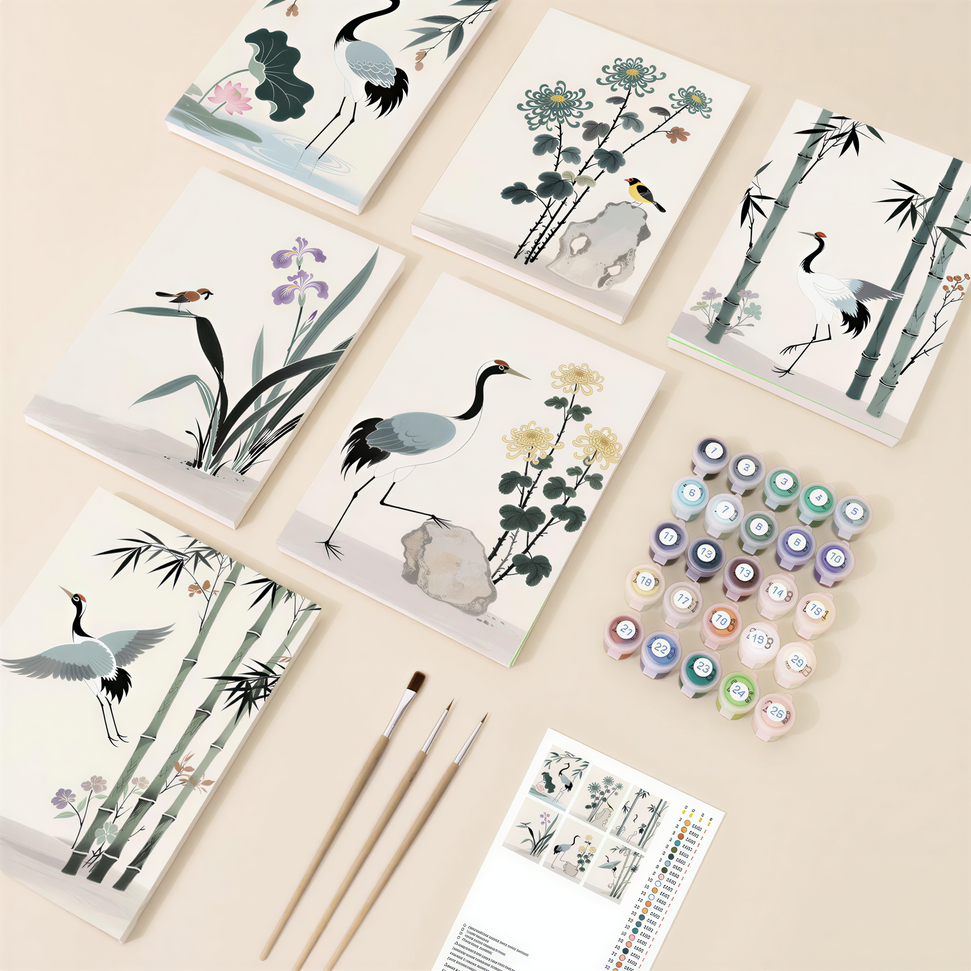 various art supplies, including paintbrushes, paint tubes, and a book with illustrations of birds and plants.