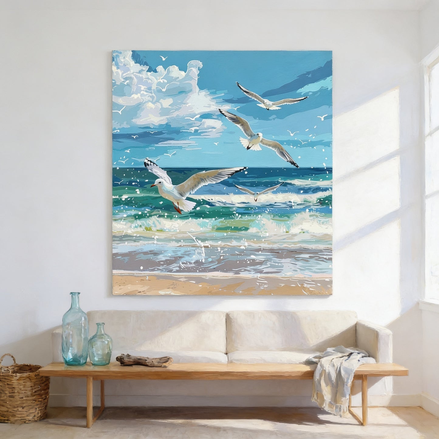 a serene beach scene with a large painting of seagulls flying over the ocean on the wall.