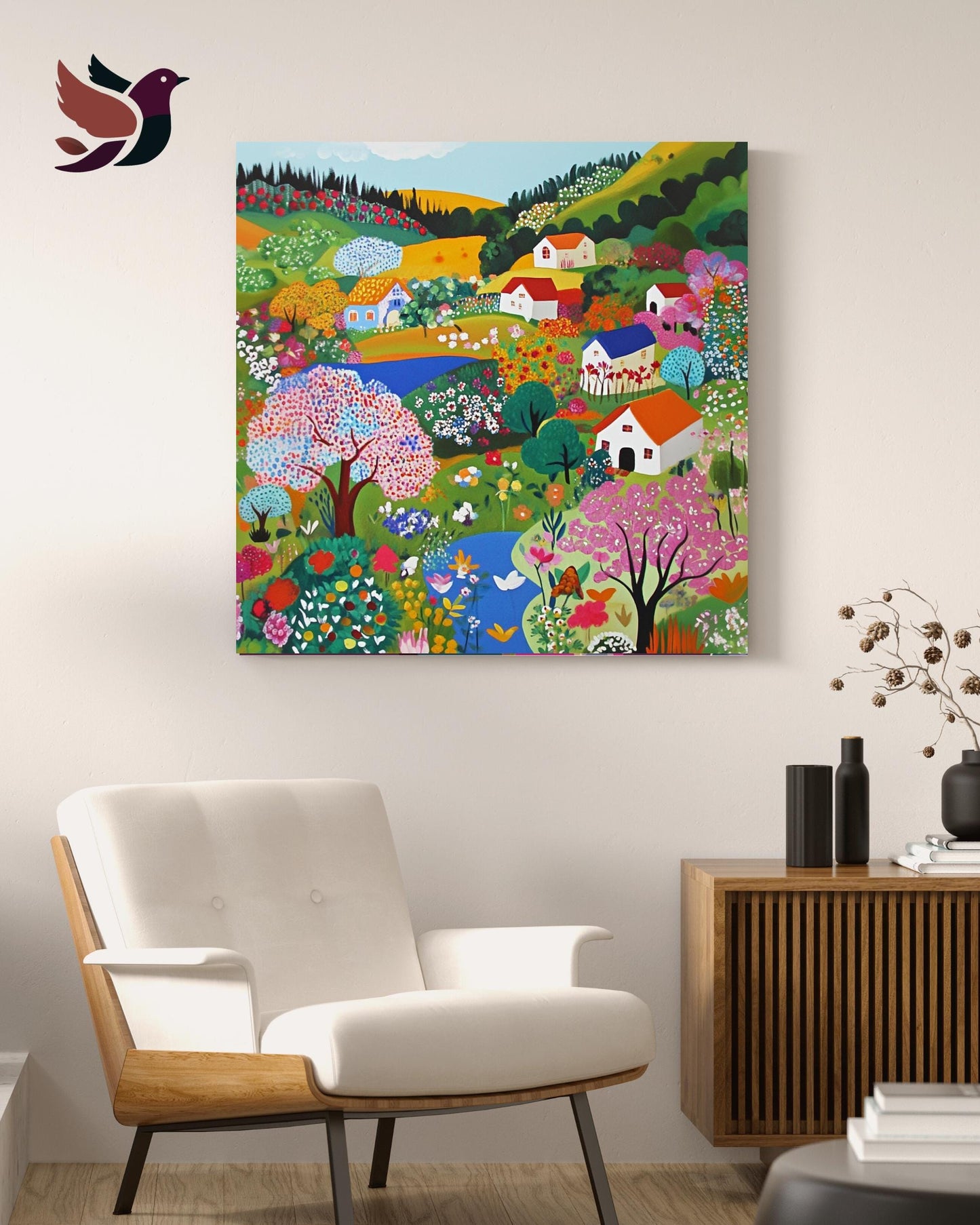 a vibrant, colorful painting of a rural landscape, with a variety of flowers, trees, and houses, hanging on a wall above a white chair in a living room setting.