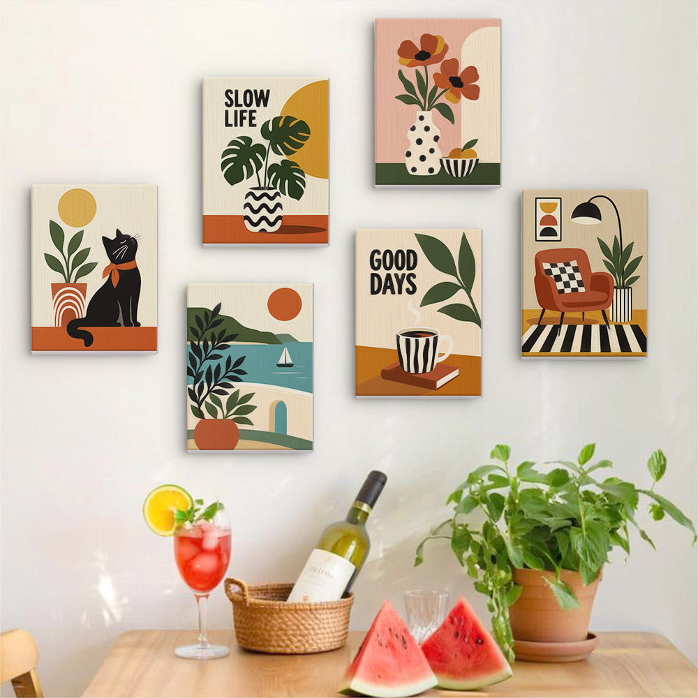 a wall with six framed artworks depicting various scenes, including a cat, plants, and other decorative elements. The artworks are arranged in a grid-like pattern on the wall. In front of the wall, there is a table with a wine bottle, a glass, and a basket of fruit, including watermelon slices.
