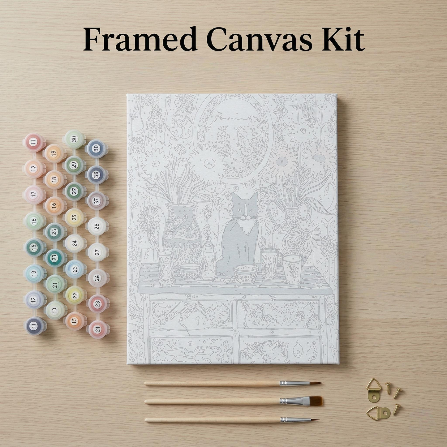 a framed canvas kit with a detailed illustration of a cat sitting on a table, surrounded by various art supplies such as paintbrushes and paint tubes.