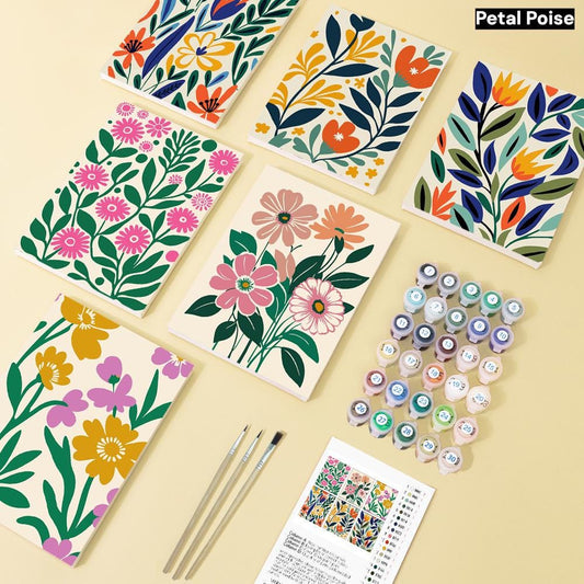 a collection of colorful floral designs, paint supplies, and brushes arranged on a light background.