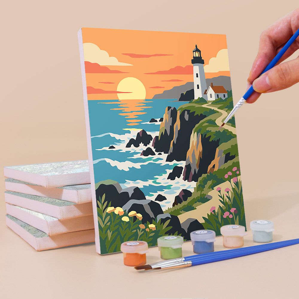 A painting of a lighthouse on a cliff overlooking the ocean, with a hand holding a paintbrush and a set of paint colors next to it.