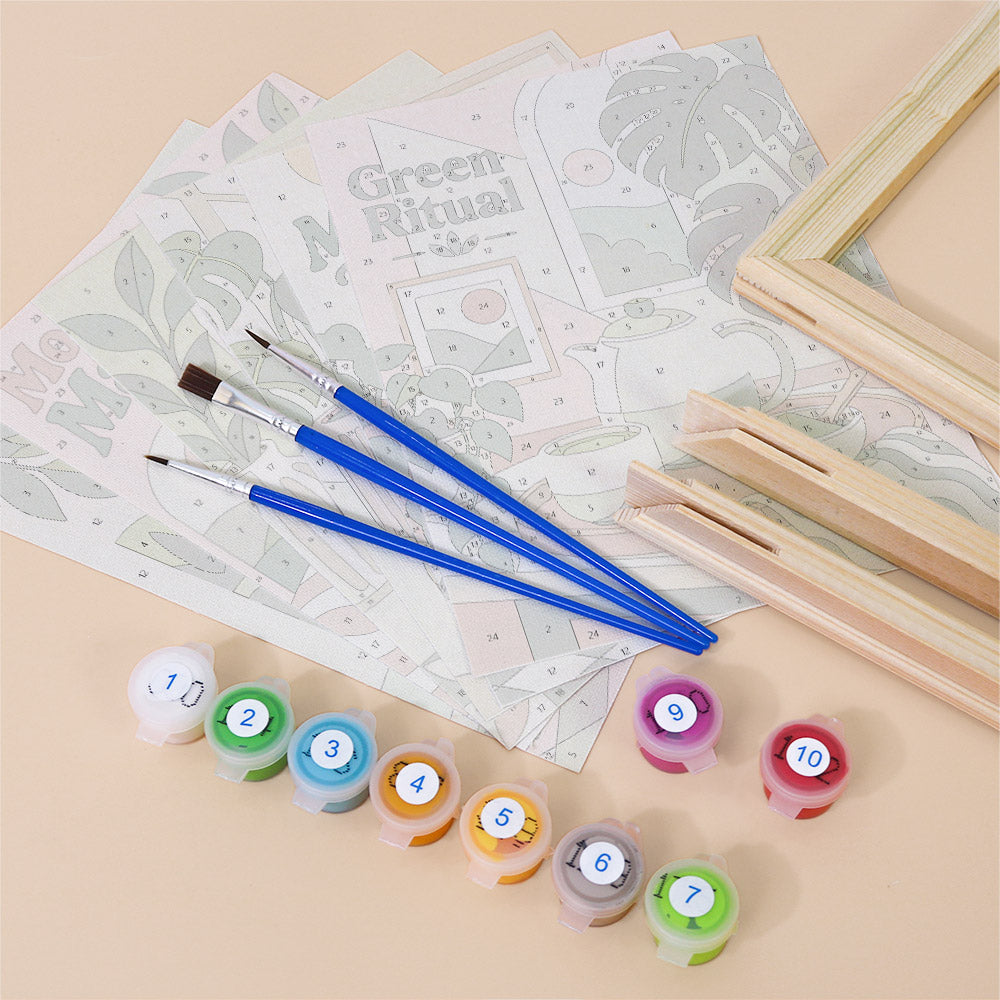 various art supplies, including paintbrushes, paint tubes, and a partially completed puzzle or coloring book.