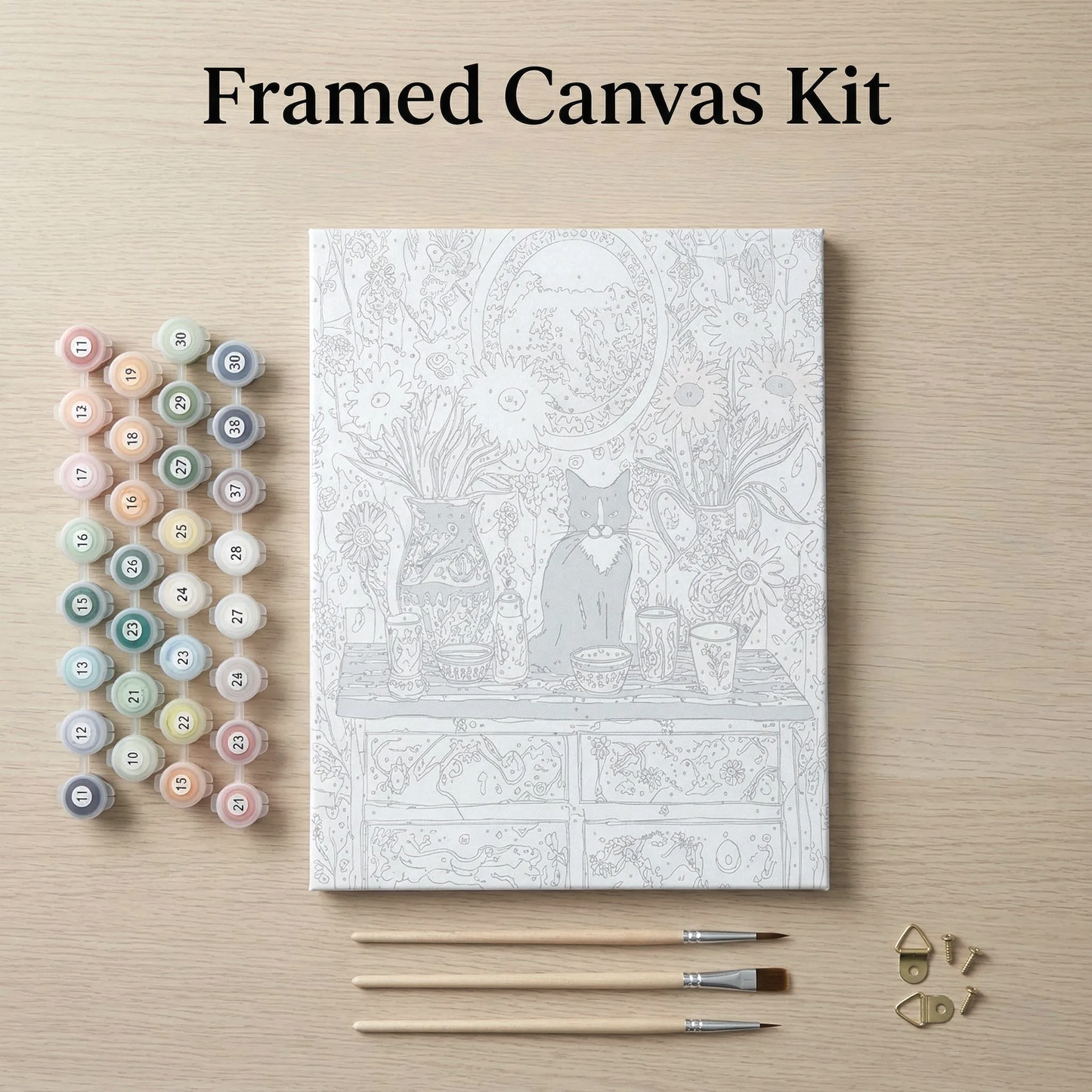 a framed canvas kit with a detailed illustration of a cat sitting on a table, surrounded by various art supplies such as paintbrushes and paint tubes.