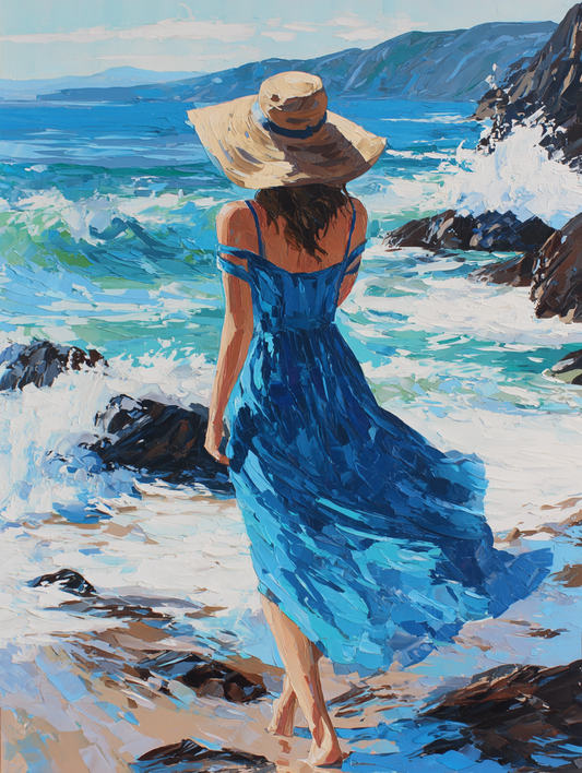A woman in a blue dress and wide-brimmed hat walks along a rocky beach, with the ocean and mountains visible in the background.