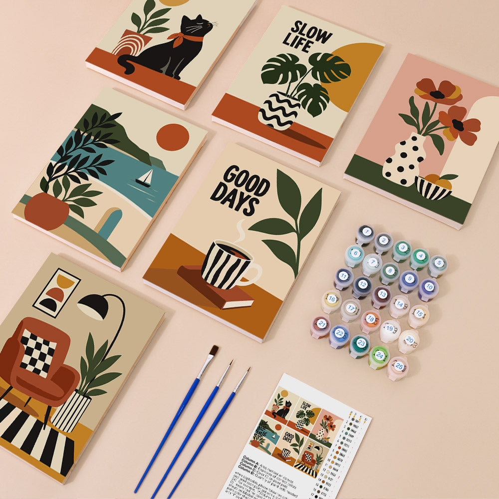 a collection of six illustrated notebooks, each featuring a unique design, along with paintbrushes, paint tubes, and a guidebook for an art project.