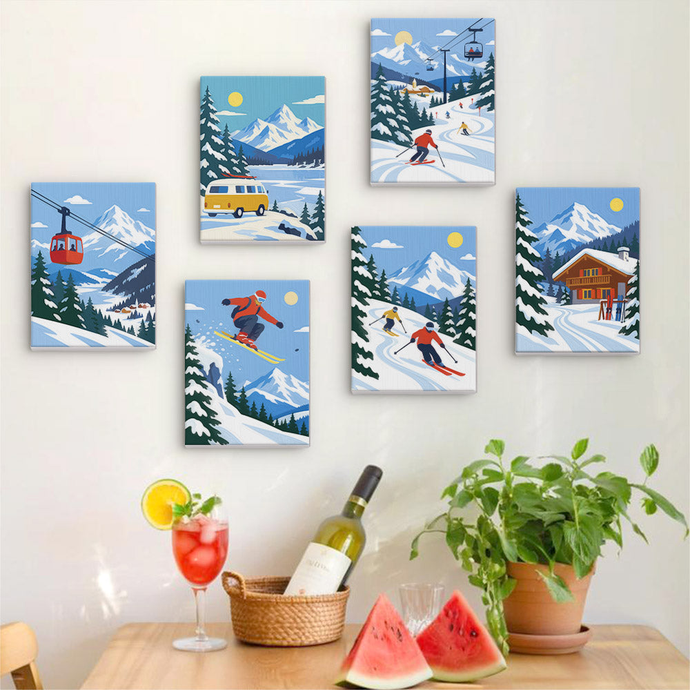 a wall with six framed pictures depicting winter sports scenes, including skiing, snowboarding, and a ski lift. In front of the wall, there is a table with a wine bottle, a glass of red wine, and a basket of watermelon slices.